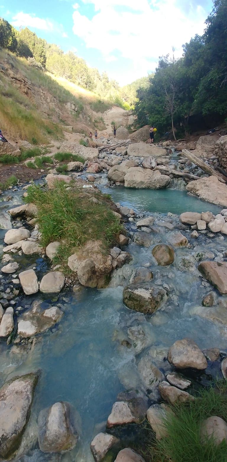 Flowing water, rocks, and trees in a Utah canyon
